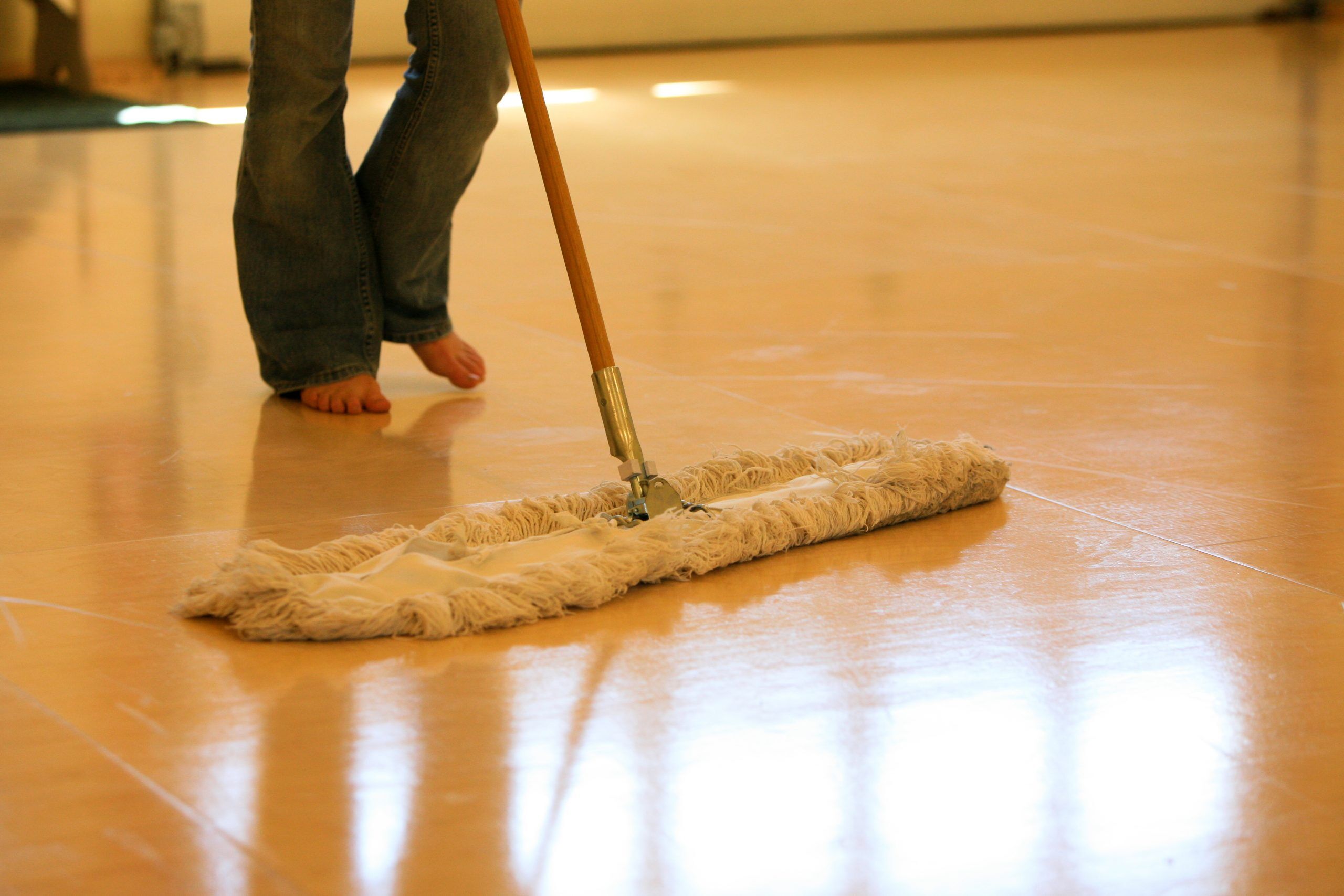 Dry mop for cleaning polished floors that are slippery when wet