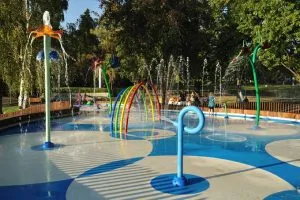 a colorful splash pad with various water features