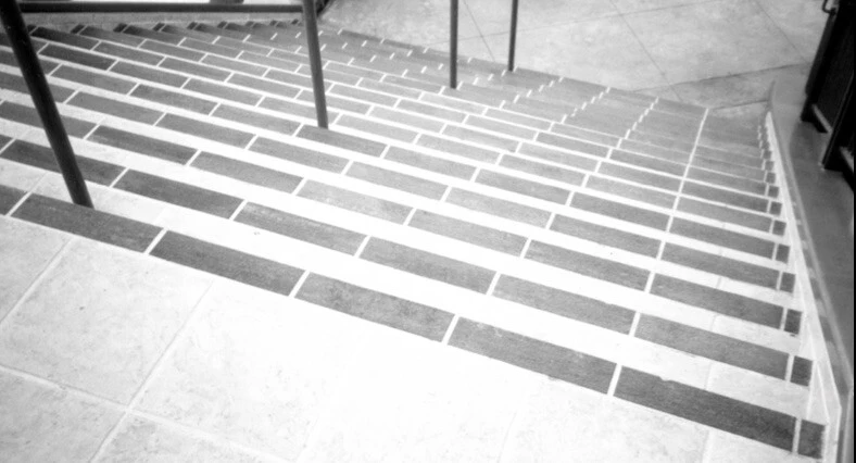 a black and white tiled staircase