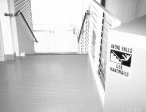 Stairway with "use handrail" sign
