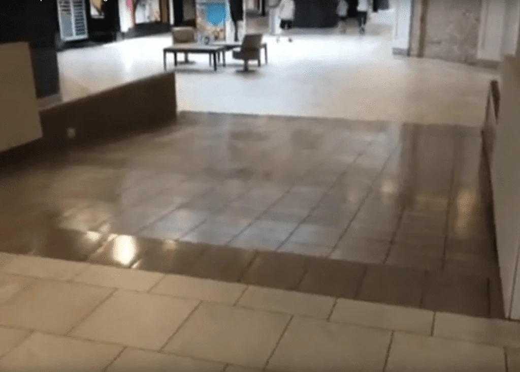 shopping mall hallway with light-colored tiled floor