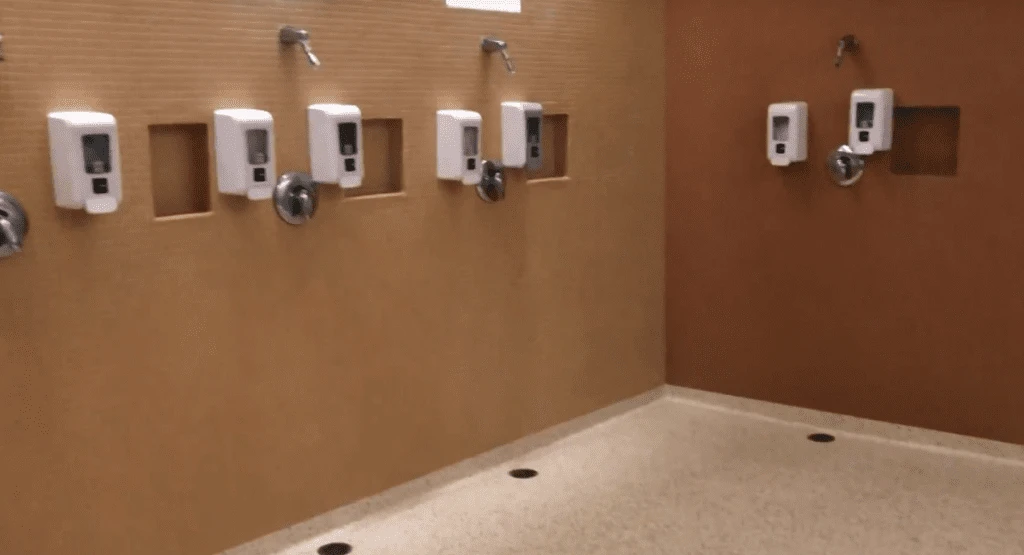 white sinks and soap dispensers