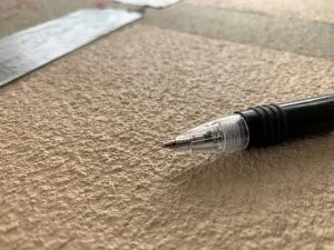 Double dose of grit added to glossy slippery paint on pool deck